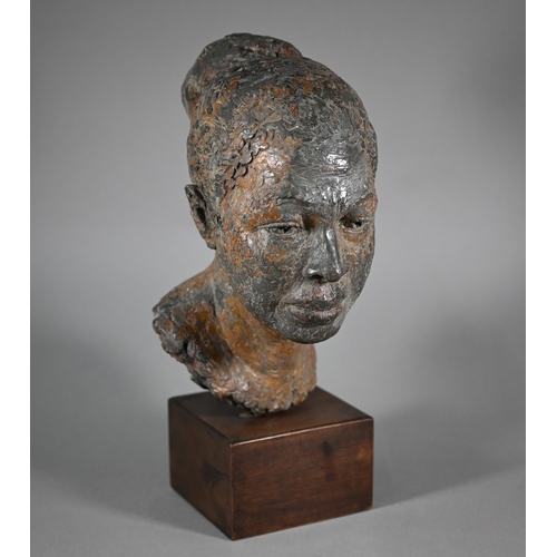 1207 - Pamela F. De Ville,  'Dolly', a bronze patinated clay bust of a young woman, raised on a wooden... 