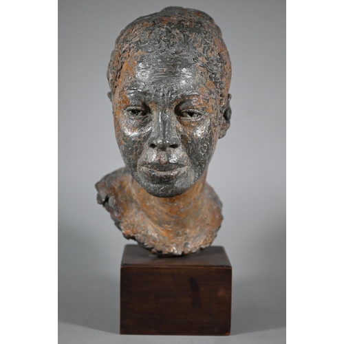 1207 - Pamela F. De Ville,  'Dolly', a bronze patinated clay bust of a young woman, raised on a wooden... 