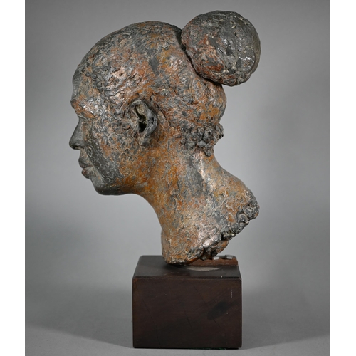 1207 - Pamela F. De Ville,  'Dolly', a bronze patinated clay bust of a young woman, raised on a wooden... 