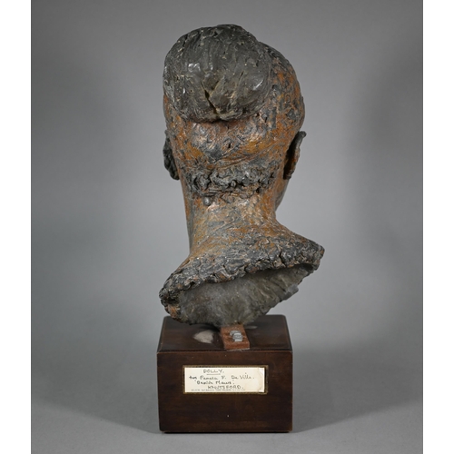 1207 - Pamela F. De Ville,  'Dolly', a bronze patinated clay bust of a young woman, raised on a wooden... 