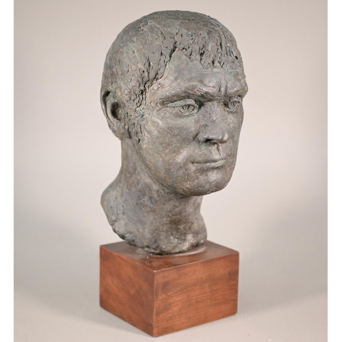 1208 - Pamela De Ville, a patinated pottery male bust, raised on a woodblock mount, 44 cm h 