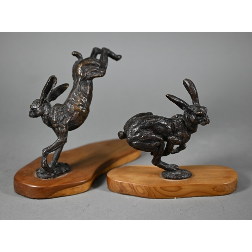 1215 - Two brown bronze sculptures of hares, one running, one leaping, both on yew wood bases, 15 cm and 13... 