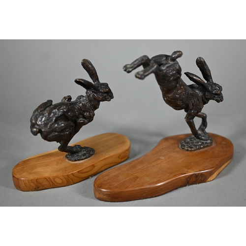 1215 - Two brown bronze sculptures of hares, one running, one leaping, both on yew wood bases, 15 cm and 13... 