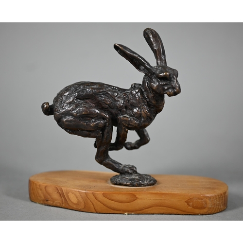 1215 - Two brown bronze sculptures of hares, one running, one leaping, both on yew wood bases, 15 cm and 13... 