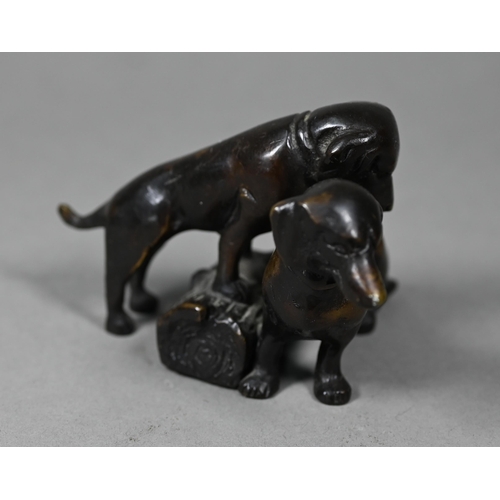 1217 - A brown bronze sculpture of two puppies, 6 cm h