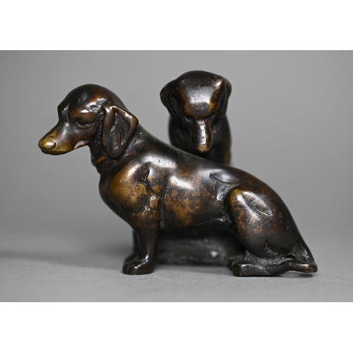 1217 - A brown bronze sculpture of two puppies, 6 cm h