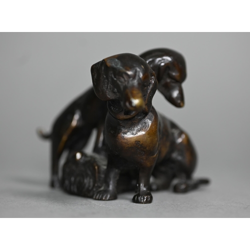 1217 - A brown bronze sculpture of two puppies, 6 cm h