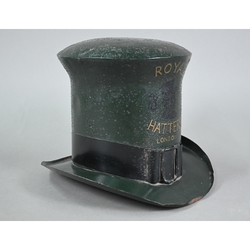 1226 - An enamelled tin trader's signed modelled as a top hat, inscribed 'Royal Hatters, London', 22 cm hig... 