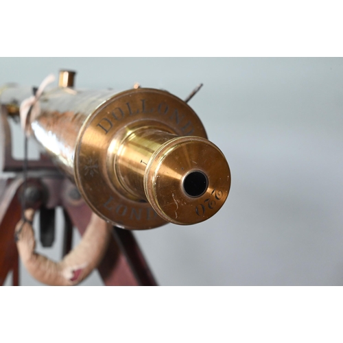 1234 - Dolland, London, a late 19th century brass tube telescope, raised on a folding wooden tripod stand -... 