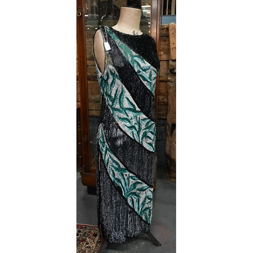 1139 - A 1920s beaded and sequin evening dress in black, white and aqua striped panels