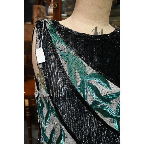 1139 - A 1920s beaded and sequin evening dress in black, white and aqua striped panels