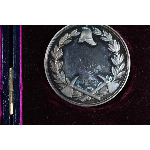 1058 - A World War I Marine Korps cross to/w an Edwardian cased silver medal cast for Clarnico Fire Brigade... 