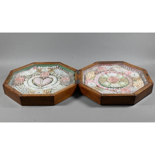1093 - A 19th century shell-work sailor's Valentine, the two hinged octagonal glazed frames worked with a '... 