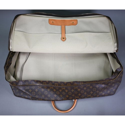 1140 - Louis Vuitton - A canvas suitcase travel bag with leather trimmings, serial number SP0977