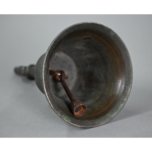 1167 - An antique bronze hand-bell with stylised floral-bud finial, 27 cm high