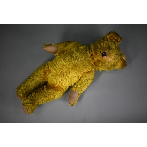 1192 - A vintage green/gold mohair teddy bear with stitched nose, swivel head and limbs, hump back and stit... 