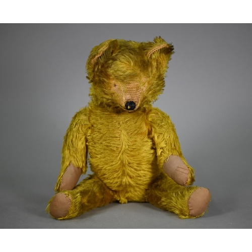 1192 - A vintage green/gold mohair teddy bear with stitched nose, swivel head and limbs, hump back and stit... 