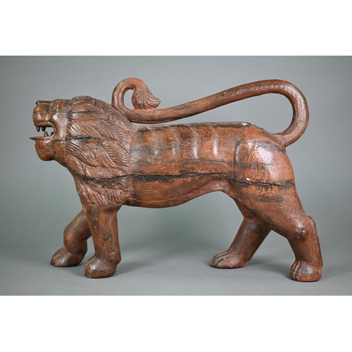 1229 - A mid-century hand carved weathered Asiatic lion, 50 cm long, 14 cm wide, 36 cm high