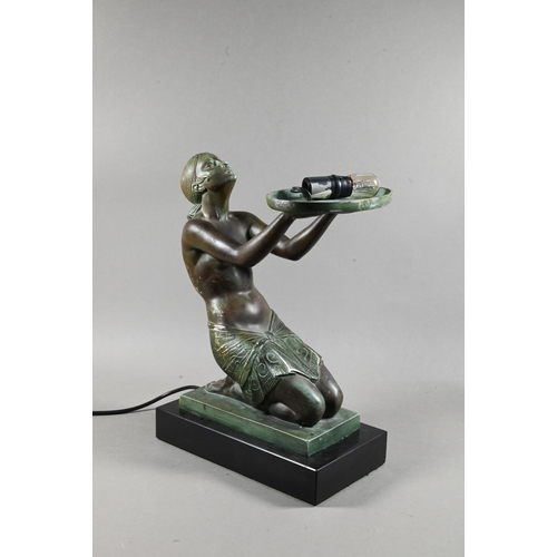 958 - An Art Deco Verdigris patinated bronze table lamp, modelled as a kneeling woman with bowl of fruit, ... 