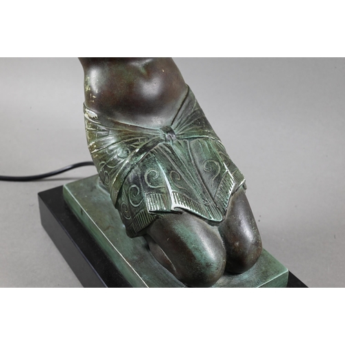 958 - An Art Deco Verdigris patinated bronze table lamp, modelled as a kneeling woman with bowl of fruit, ... 