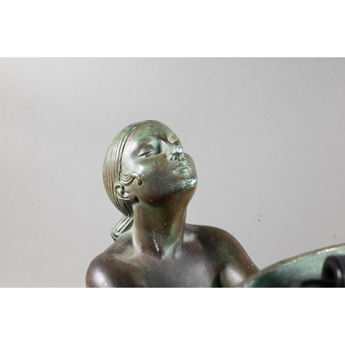 958 - An Art Deco Verdigris patinated bronze table lamp, modelled as a kneeling woman with bowl of fruit, ... 