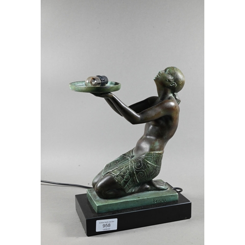 958 - An Art Deco Verdigris patinated bronze table lamp, modelled as a kneeling woman with bowl of fruit, ... 