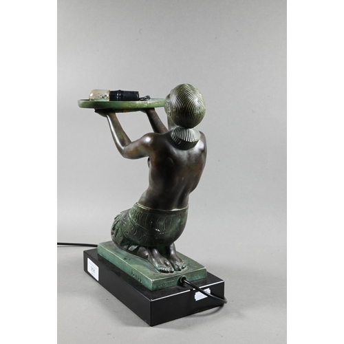 958 - An Art Deco Verdigris patinated bronze table lamp, modelled as a kneeling woman with bowl of fruit, ... 