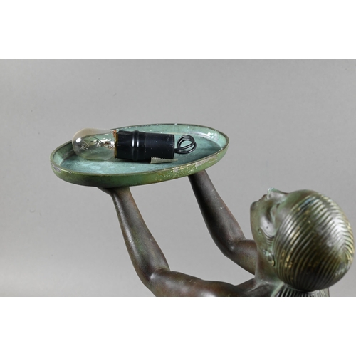 958 - An Art Deco Verdigris patinated bronze table lamp, modelled as a kneeling woman with bowl of fruit, ... 