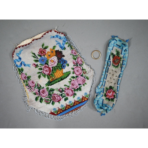 1120 - A 19th century glass beadwork pouch decorated with a basket of flowers to one side, and a butterfly ... 