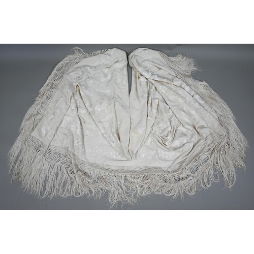 1123 - A circa 1930s cream silk 'piano' shawl with floral decoration and long fringe, approx 180 cm square ... 