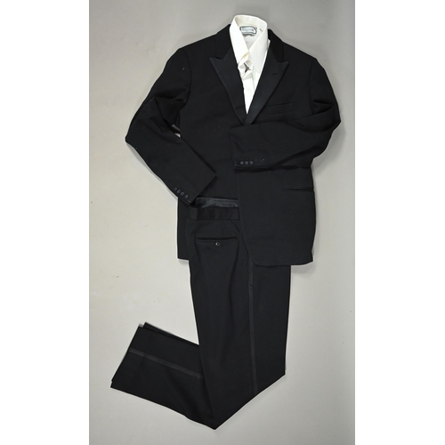 1131 - Hector Powe - A gentleman's black woollen dinner jacket and trousers c/w shirt with ribbed front, 44... 