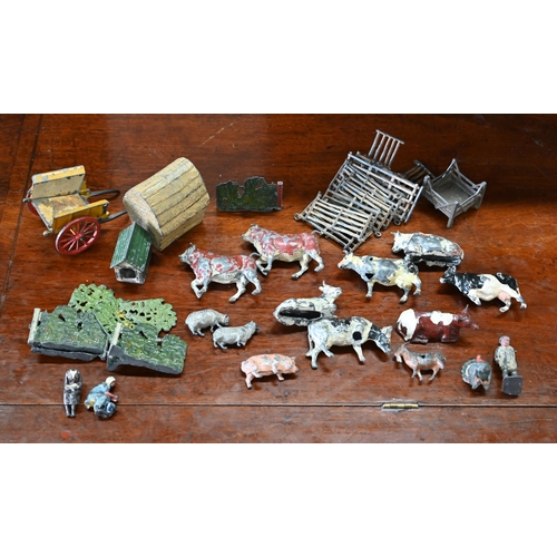 1182 - A quantity of Britains die-cast farm animals and other figures, fencing, hay-rick, wagon etc - all i... 