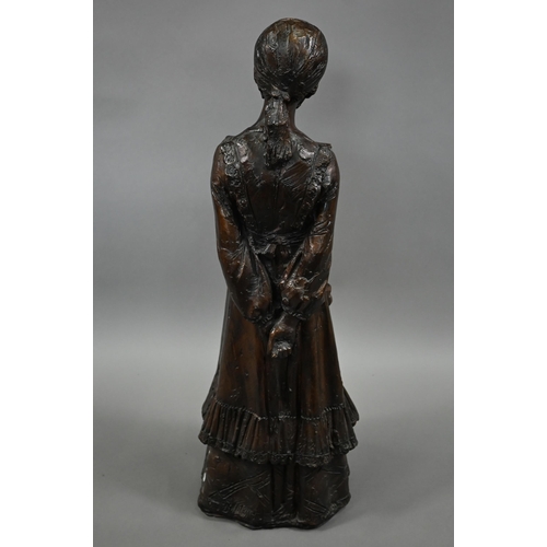 1210 - A bronzed pottery sculpture of a young woman, standing, in a long dress, 77 cm h