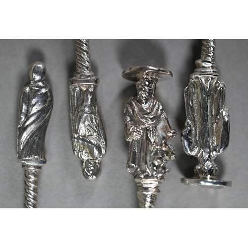 145 - Four various 18th/19th Century Continental silver serving spoons with figural finials; stamps on bac... 