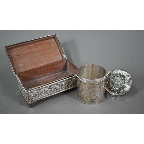 27A - A selection of Indian low-grade silver with chased and engraved decoration, including a toroidal pos... 