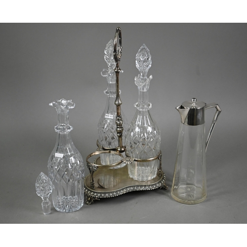 40 - A Victorian electroplated decanter stand fitted with three cut glass decanters, to/w a glass claret ... 