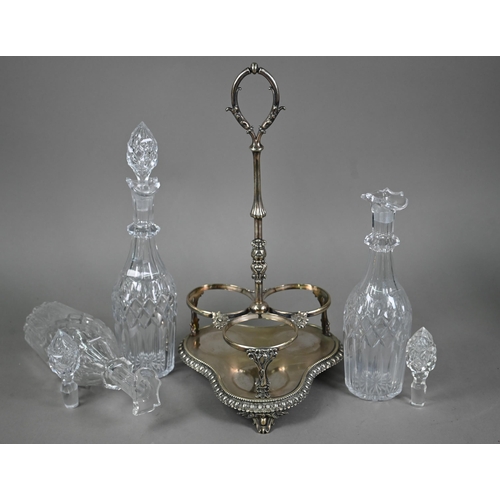 40 - A Victorian electroplated decanter stand fitted with three cut glass decanters, to/w a glass claret ... 