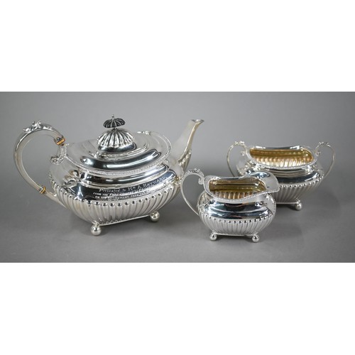 89 - A heavy quality Edwardian Regency Revival three-piece tea service of oblong half-reeded and compress... 