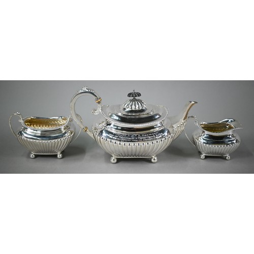 89 - A heavy quality Edwardian Regency Revival three-piece tea service of oblong half-reeded and compress... 