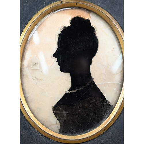 1107 - A Regency silhouette of a gentleman, by Miers & Field, 111 The Strand, London, 8 x 6.5 cm, in eb... 