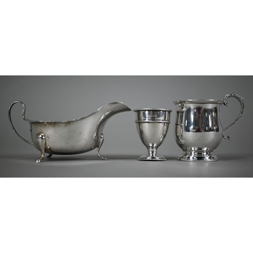 159 - A silver sauce-boat, Viners, Sheffield 1939, to/w Christening mug, Birmingham 1954 and an egg-cup, L... 