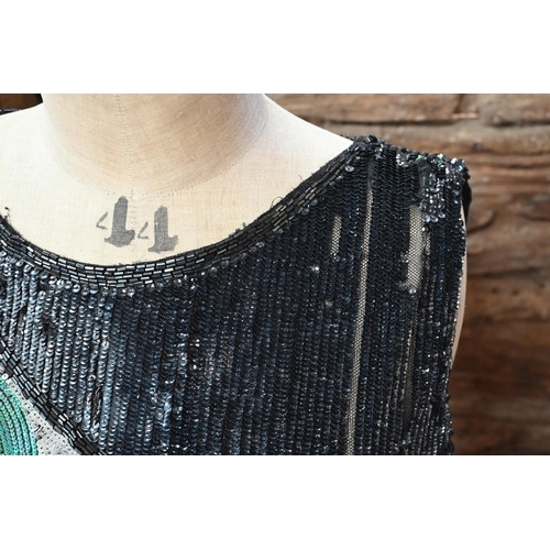 1139 - A 1920s beaded and sequin evening dress in black, white and aqua striped panels