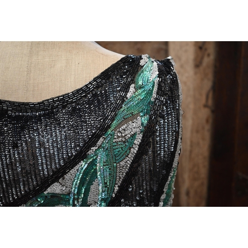 1139 - A 1920s beaded and sequin evening dress in black, white and aqua striped panels