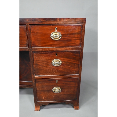 410 - # A Victorian mahogany bowfront kneehole desk, with six drawers and recessed cupboard, raised on spl... 