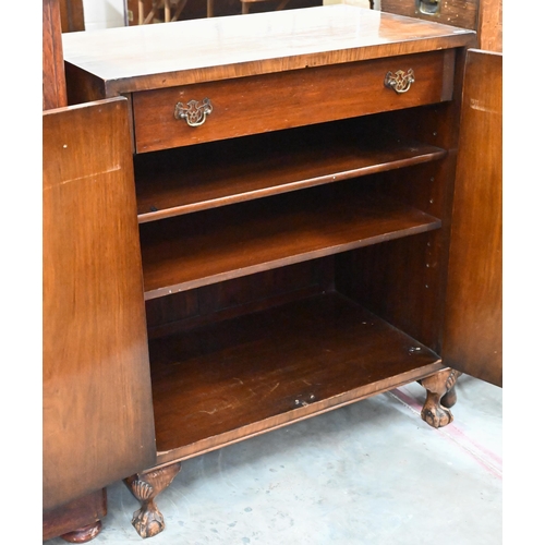 411 - An Oriental style walnut two door cocktail/side cabinet with engraved brass mounts, shell carved bal... 