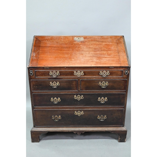 A George III mahogany bureau, the fitted interior with slide top well over a dummy drawer, two short and two long graduated drawers, a brass carrying handle to each side, raised on shaped bracket feet, 92 cm w x 51 cm x 104 cm h
