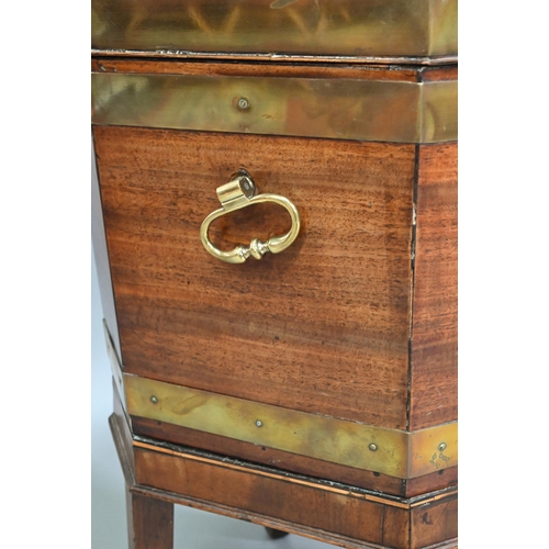 534 - A George III brass bound mahogany wine cooler of octagonal form, with internal zinc liner, raised on... 