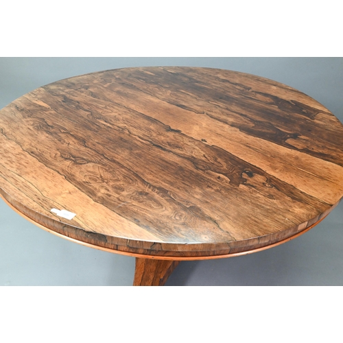 542 - An early Victorian rosewood breakfast table, the circular tilt top raised on a turned support, to a ... 