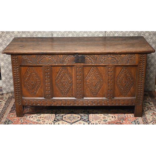 471 - An early 18th century carved oak coffer, 145 cm x 57 cm x 71 cm h