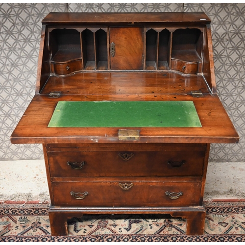 501 - Mahogany fall front bureau with four long graduating drawers on tall bracket feet, 72 cm w x 42 cm d... 